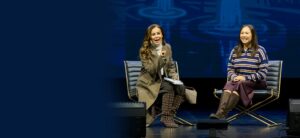 Two women seated on stage at the "Time to Rally" event, discussing mindful digital and social media use for mental wellness.